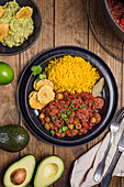 Picadillo with yellow rice and chopped plantain (Cuba)