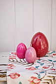 Easter-egg candles decorating table