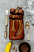 Freshly baked dark chocolate banana bread cake dessert and ingredients