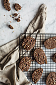 Crunch cookies with cocoa and almonds on a wire rack