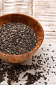 Chia seeds in a wooden bowl