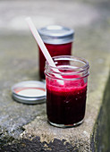 Beetroot juice in a jar with a straw