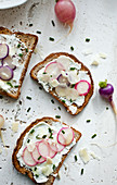 Whole wheat toast with goat cheese, radishes, chives, parmesan and olive oil