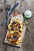 Potato pizzas topped with mushrooms and peppers