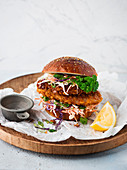 A chicken burger with coleslaw