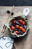Grilled tomatoes and beetroot with soy sauce and sesame seeds (Asia)