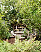 Split-level terrace in lush garden