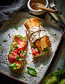Baguette sandwich with ham, cucumber and basil