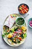 Spicy wraps with chickpeas and vegetables and pesto