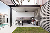 Covered terrace in the courtyard garden with pool