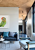 Living room with a picture of a parrot in an open architect's house