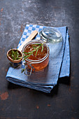 Quince jelly with rosemary on a kitchen towel
