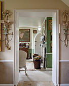 Regency-style candle sconces flanking living room door