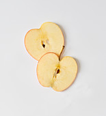 Apple slices on a white surface