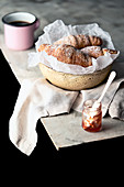 Croissant, marmalade and coffee on the table