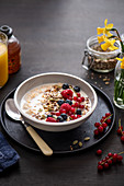 Bircher muesli (oats soaked in milk overnight) with honey and fresh fruit