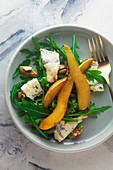 Rocket salad with blue cheese, walnuts and caramelised pears
