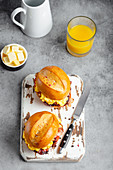 Breakfast sandwiches with scrambled egg, bacon, cheese and tomato