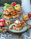 Apple blondies with walnuts, served with whipped cream and caramel sauce