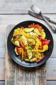 Curry rice with poultry, peppers and zucchini