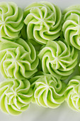Green frosting dots as cake decoration