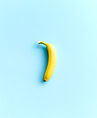 A banana on a blue surface