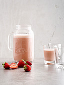Pink grapefruit smoothie made with strawberries and yoghurt