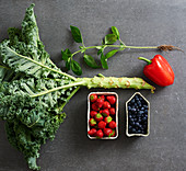 Kale, basil, pepper, strawberries and blueberries