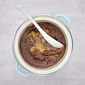 Chocolate semolina pudding with pears, hazelnuts and cinnamon