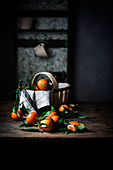 Mandarins and basket on table