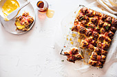 Savoury hot cross buns with bacon and cheese
