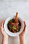 Dukkah-roasted lamb shanks with pine nuts and sultana salsa