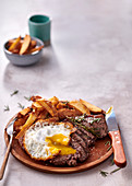 Portuguese-style steak with egg and chips