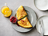 A fluffy omelette with almonds and apricot sauce