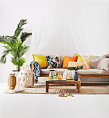 Couch with canopy, coffee table, side table and palm tree