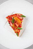 A piece of blood orange and strawberry tart