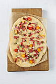 Moarwirtbrot (yeast flatbread) with bacon and cherry tomatoes