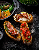 Various types of bruschetta on a wire rack