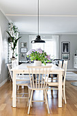 Open-plan dining area with view into living room