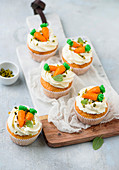 Decorated cream cheese cupcakes with pistachios