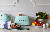 Retro toaster, sliced bread and breakfast ingredients
