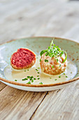 Beetroot dumplings with a cheese sauce