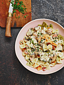 Colourful farfalle with mushrooms and bacon
