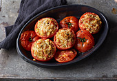 Tomatoes with a crispy millet and herb filling