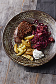 Steak with red cabbage and potatoes