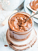 Jar full of homemade nutella, hazelnut chocolate spread (vegan, sugar-free)