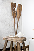 Stool and paddles in corner