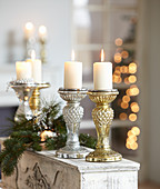 Christmas arrangement of sparkling silver and gold candlesticks