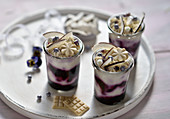 Vegan coconut and blueberry cheesecakes in glasses