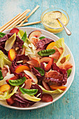 Late summer salad of stone fruit radiccioand proscuitto